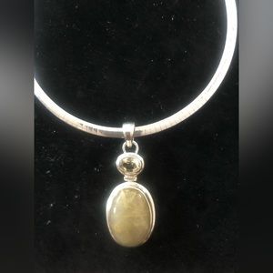 Sterling Silver pendant with a Semi Precision stone
